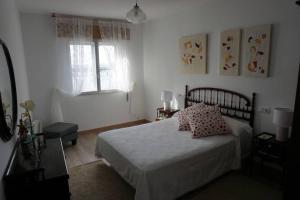 Łóżko lub łóżka w pokoju w obiekcie CASA DA MADRIÑA