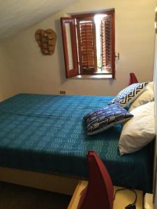 Кровать или кровати в номере Villa Delle Conchiglie