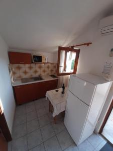 Kuchyň nebo kuchyňský kout v ubytování Apartmani Toni - Kućica + 4 fotografie