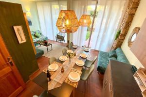 a dining table and chairs in a living room at Boho Chic Beach Resort in Sardegna in Porto Istana
