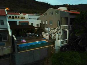 an aerial view of a house with a swimming pool at Cactus Guest House in Cidade Velha