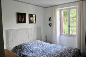 Säng eller sängar i ett rum på Castel Rouge