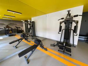 a gym with several exercise bikes and a mirror at Lawenda Krynicka in Krynica Morska