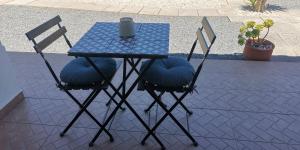 
a table with chairs and a table cloth at Maravilha da Costa in Aljezur
