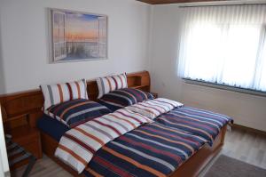 two beds sitting next to each other in a room at Ferienwohnung Stambach in Contwig