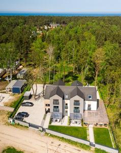 an aerial view of a large house with a yard at U przyjaciol - Debki in Dębki
