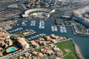 an aerial view of a marina with boats in the water at Appartement naturiste PaulAna Port Ambonne 314 in Cap d'Agde