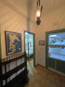 a hallway with a staircase and a door to a room at Patmos Villas in Grikos