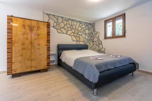 Ένα ή περισσότερα κρεβάτια σε δωμάτιο στο Apartments Kira Crikvenica