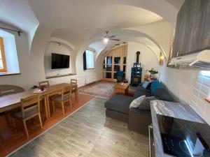 a living room with a couch and a table at Apartment Mařenka Frymburk in Frymburk