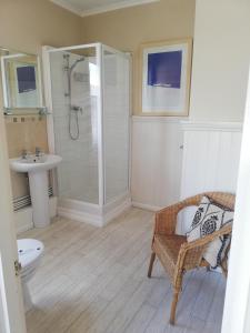 a bathroom with a shower and a sink at Gyves House in Eastbourne