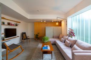 a living room with a couch and a table at Casa d´Avó Dalina in Figueira da Foz