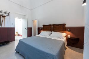 Krevet ili kreveti u jedinici u okviru objekta Dimora Del Vescovo Guest House