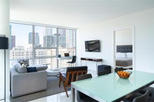 a living room with a couch and a table at Luxury Highrise Living Downtown LA in Los Angeles