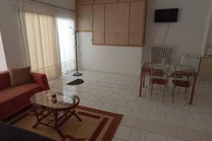 a living room with a couch and a table at Semith Home 1 in Kalabaka +13 photos