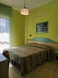 Giường trong phòng chung tại Hotel Prestigio