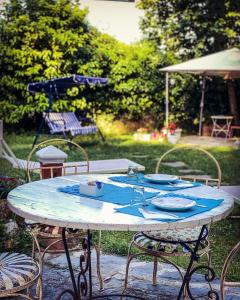 a table topped with a blue and white table cloth at B&B Antico Frantoio Pietrasanta in Pietrasanta