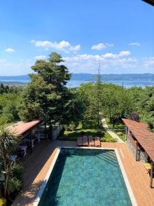 a swimming pool with a view of the water at Rif Sapanca - Adult Only in Sapanca