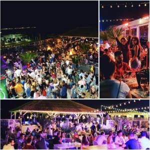 un grupo de personas en una fiesta por la noche en Summerland Sea & Lake, en Mamaia