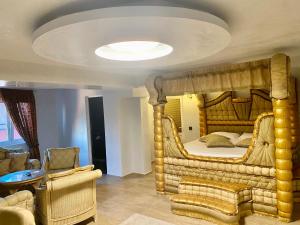 a bedroom with a large bed with a large mirror at Bali Colosseum Hotel in Belgrade