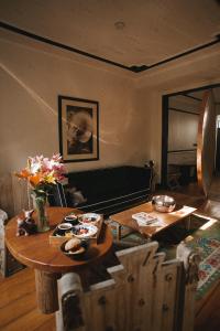 
a living room filled with furniture and a fireplace at La Valise Mexico City in Mexico City
