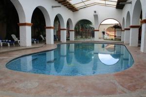 Bazén v ubytovaní Hacienda Tepetlcalli by Rotamundos alebo v jeho blízkosti