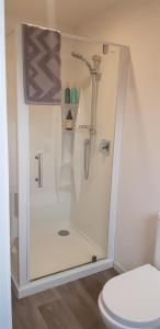 a shower in a bathroom with a toilet at 'The Crib' on Legacy Vineyard in Alexandra