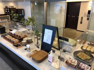 a counter with some food on top of it at Via Inn Nagoya Station Tsubaki-cho in Nagoya