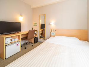 Tempat tidur dalam kamar di Super Hotel Ueno-Okachimachi