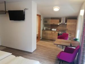 TV a/nebo společenská místnost v ubytování Hotel Posauner