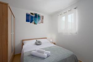 Postel nebo postele na pokoji v ubytování Holiday Home Drvenik