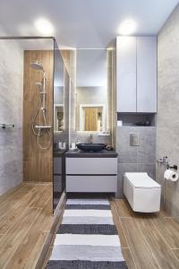 a bathroom with a sink and a shower at Board apart hotel in Odesa +156 photos