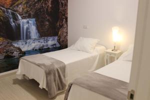 Postel nebo postele na pokoji v ubytování Acogedor apartamento en el centro de Monforte