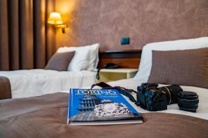 Postel nebo postele na pokoji v ubytování Hotel Plaza