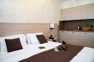 Postel nebo postele na pokoji v ubytování Hotel Plaza