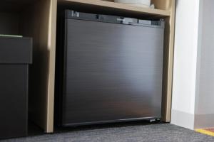 a metal garage door with a shelf on top at Super Hotel Nagoya Shinkansenguchi in Nagoya