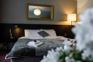 Postel nebo postele na pokoji v ubytování Hotel Marino