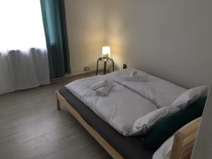 Voodi või voodid majutusasutuse Imola Apartman Fonyód toas
