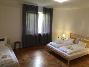 Voodi või voodid majutusasutuse Imola Apartman Fonyód toas