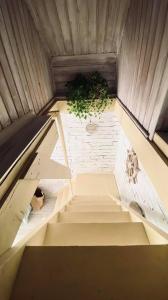 an overhead view of a staircase with a plant at Napraforgó Vendégház in Gárdony