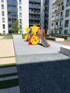 Plac zabaw dla dzieci w obiekcie Gdansk Apartament Harmonia Oliwska