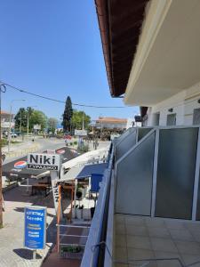 a view of a marina with a boat in a parking lot at Rodica Studios in Kallithea Halkidikis