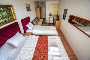 a room with two beds and a kitchen at Apartments Monte in Ulcinj +229 photos