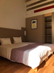 Postel nebo postele na pokoji v ubytování Hotel Cristol