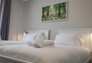 Postel nebo postele na pokoji v ubytování Hotel Peroni
