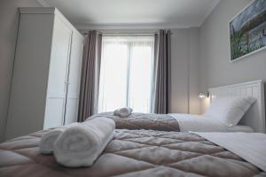 Postel nebo postele na pokoji v ubytování Hotel Peroni