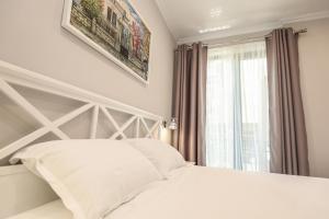 Postel nebo postele na pokoji v ubytování Hotel Peroni