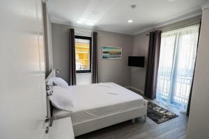 Postel nebo postele na pokoji v ubytování Hotel Peroni