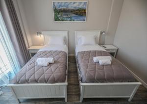 Postel nebo postele na pokoji v ubytování Hotel Peroni