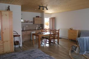 a kitchen and dining room with a table and chairs at Ubytování v soukromí Klima in Český Krumlov